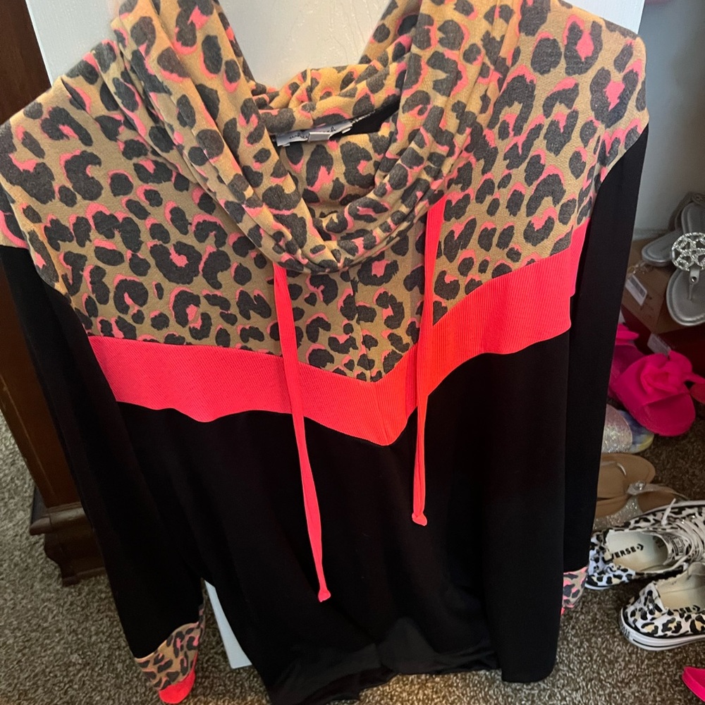 Black with neon pink leopard cowl neck top. Boutique brand.